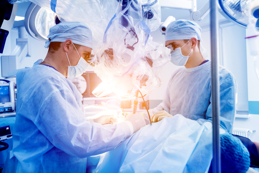 doctors performing spine surgery
