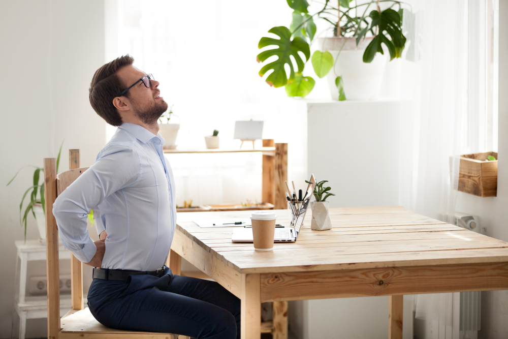 office worker stretching in chair